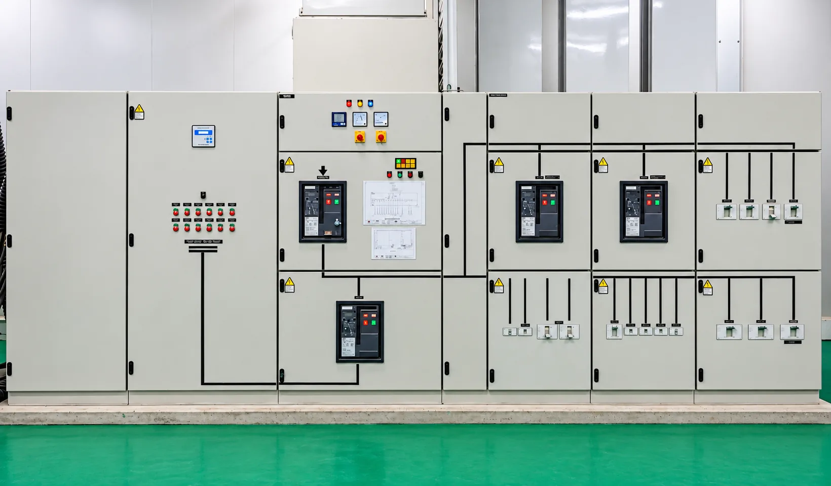 Low-voltage distribution switchboard with main circuit breakers, power factor correction and outgoing distribution feeders.