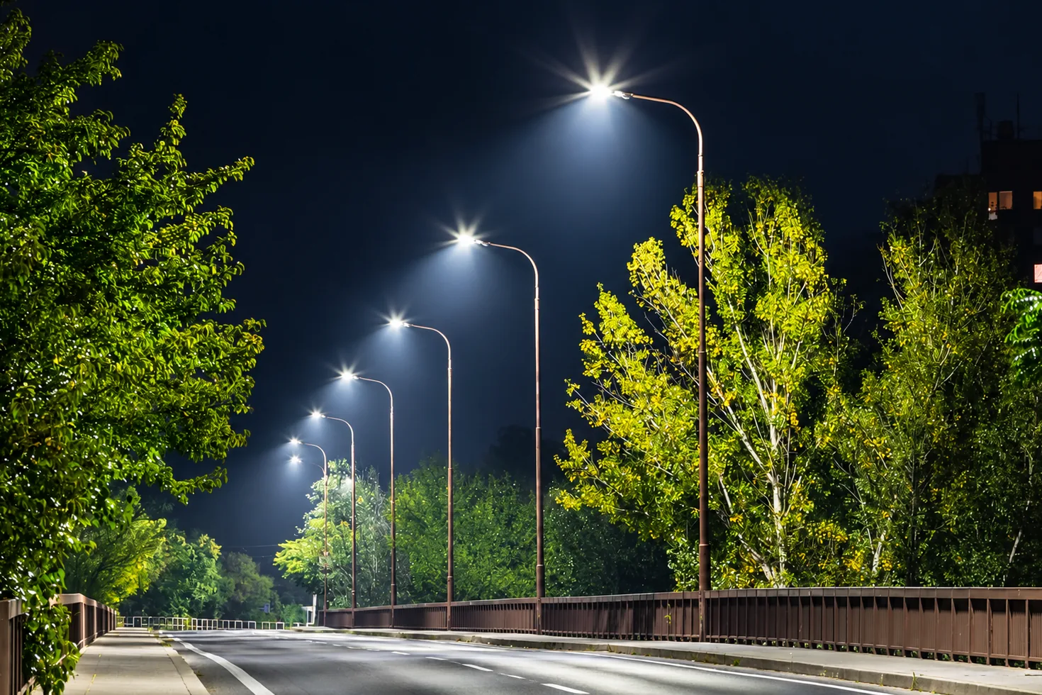 Road lined with LED street lights at night