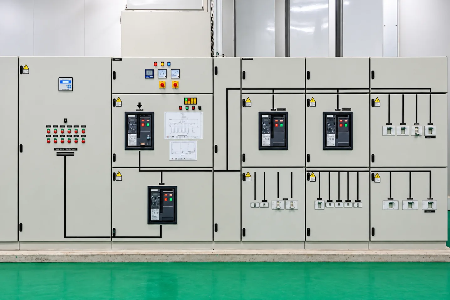 Low-voltage distribution switchboard with main circuit breakers, power factor correction and outgoing distribution feeders.